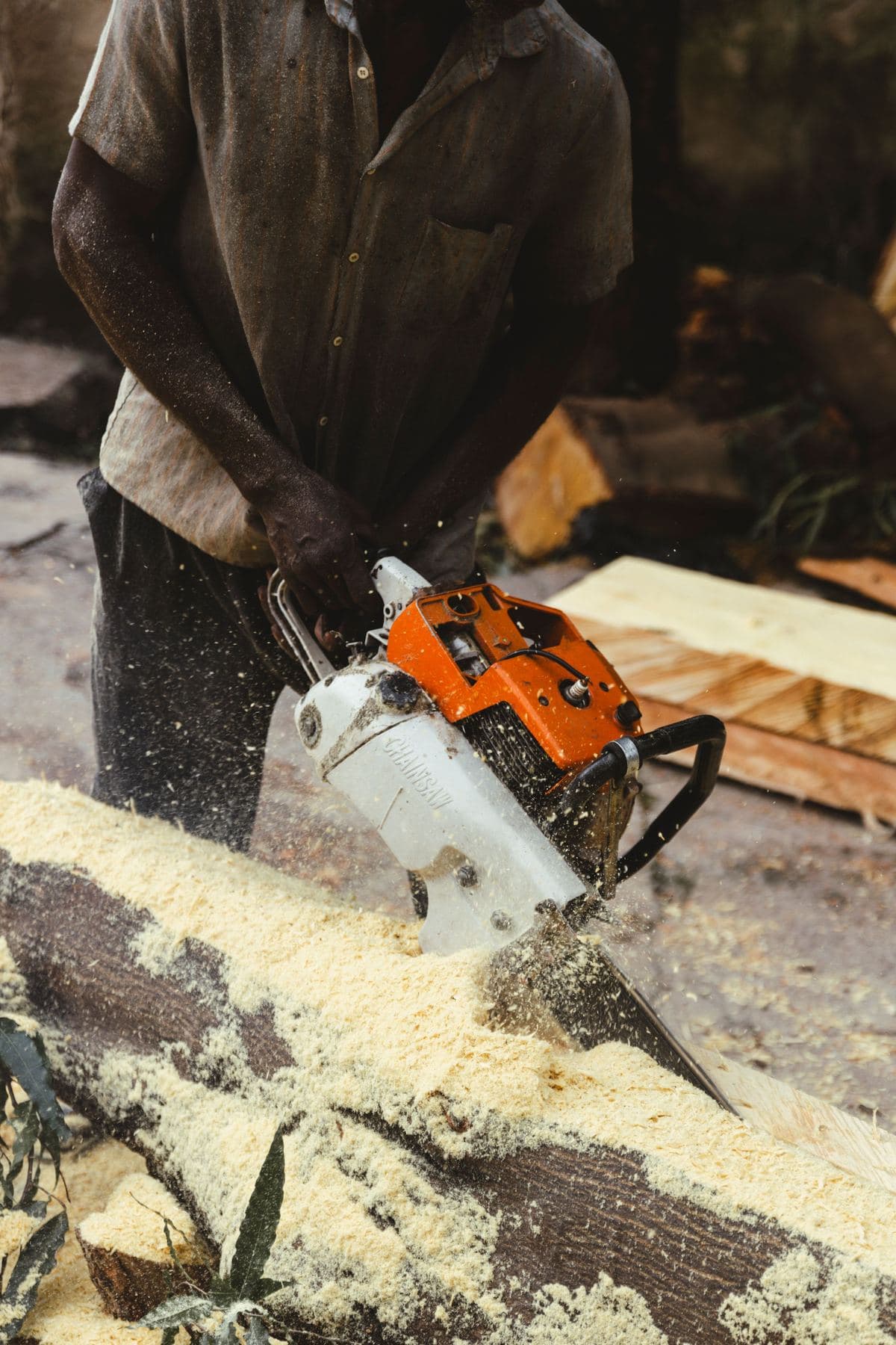 Chainsaw cutting through a log