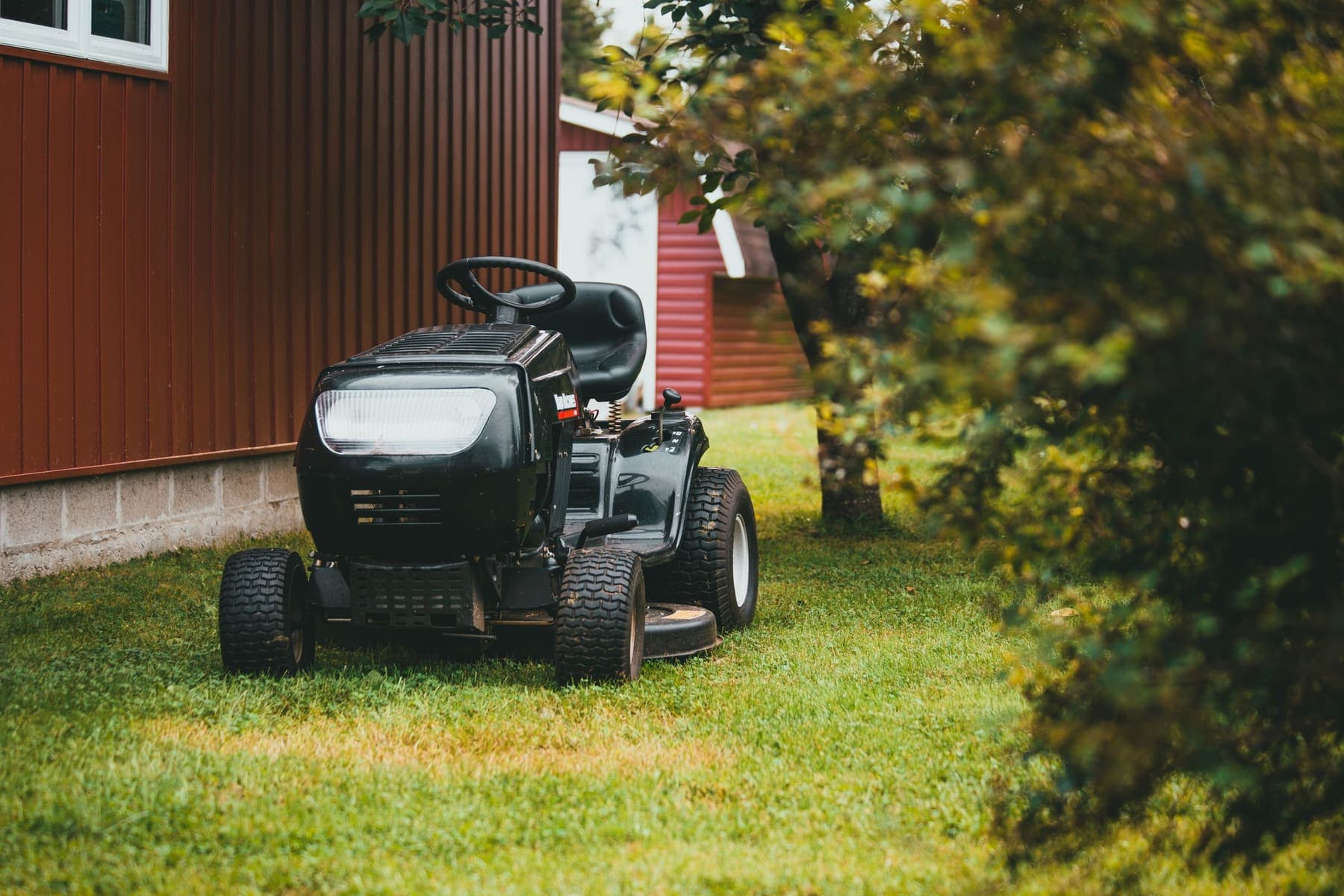 Riding mower on a lawn