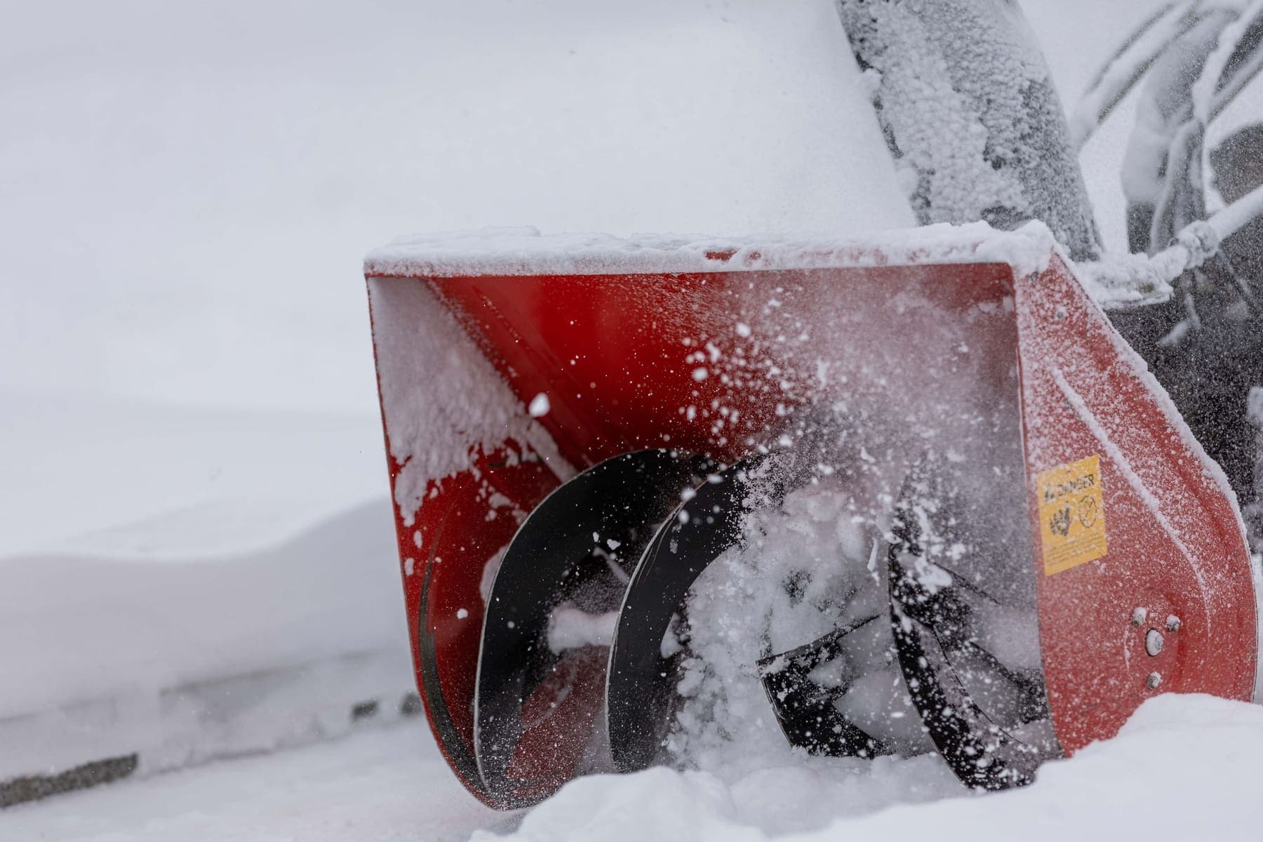 Snow blower auger throwing snow