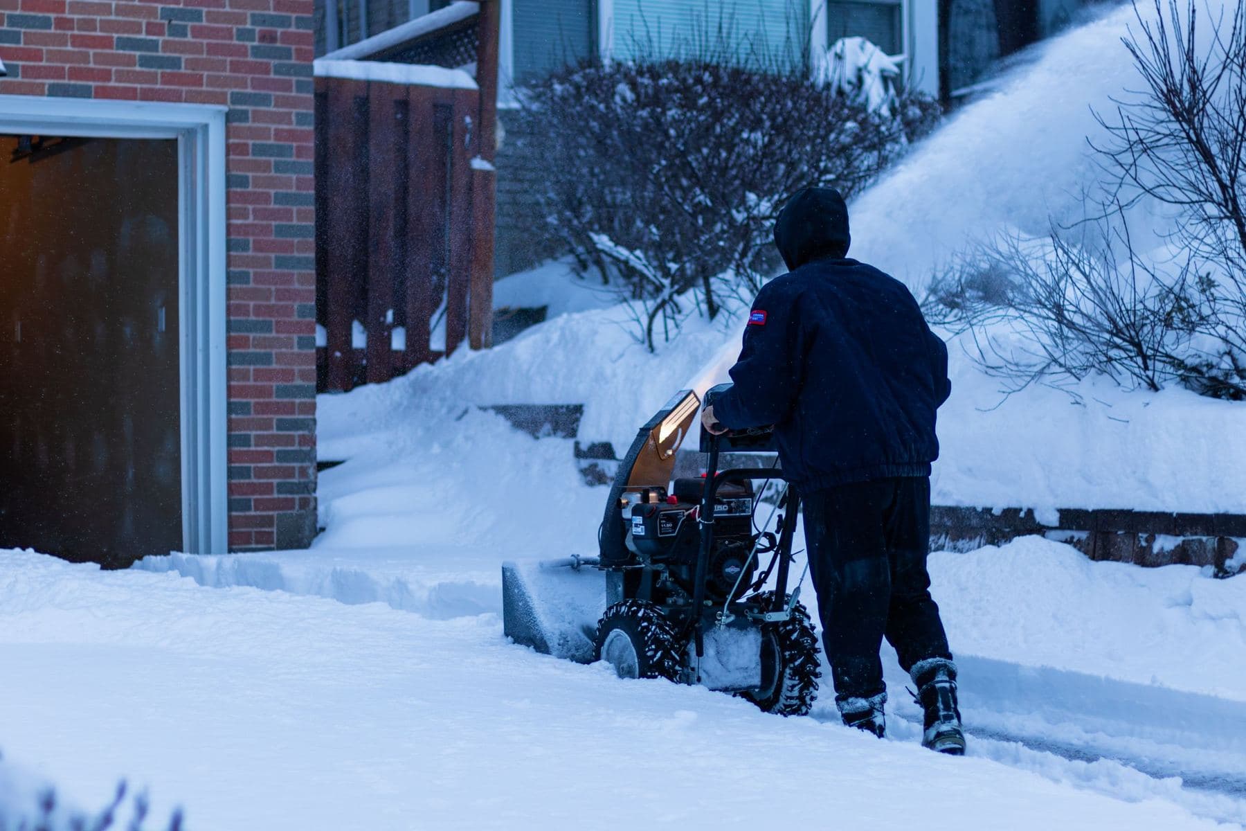 Snow blower clearing a driveway